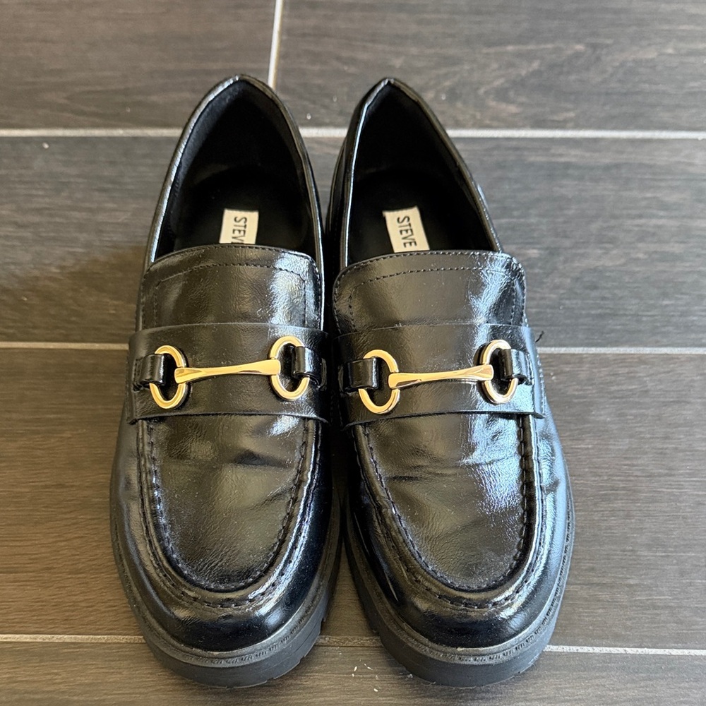 Steve Madden Glossy Black Loafers with Gold Detailing